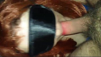 Redhead wife has oral sex with a mask...
