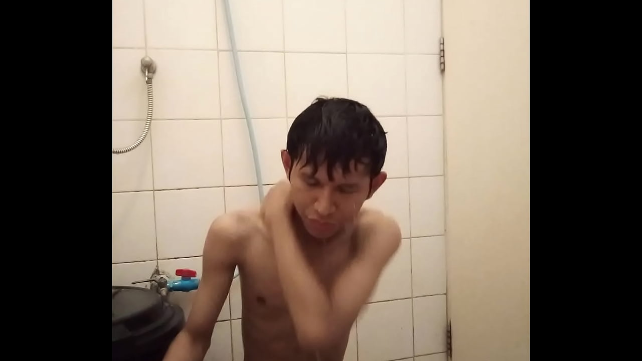 Skinny Dark Skinned Asian Teen Boy College Student Clean his Uncut Cock while Taking Shower photo